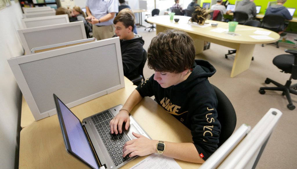 Tony Magaw a 16-year-old junior at Menomonee Falls High School works on his laptop computer during class. (Photo by Mike De Sisti/Milwaukee Journal Sentinel)