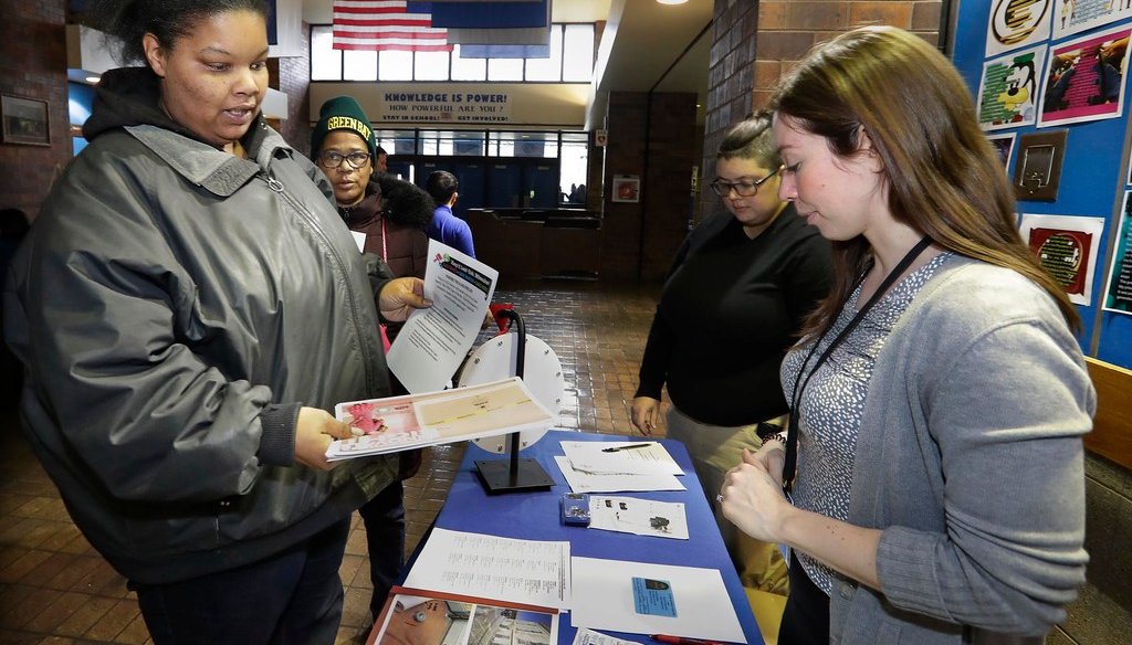 Margaret Howlett, Milwaukee, who has a 4 year-old and a 13 year-old, chats about ways to minimize exposure to lead in water supplies to her home during an April 2019 event. (Rick Wood/Milwaukee Journal Sentinel)