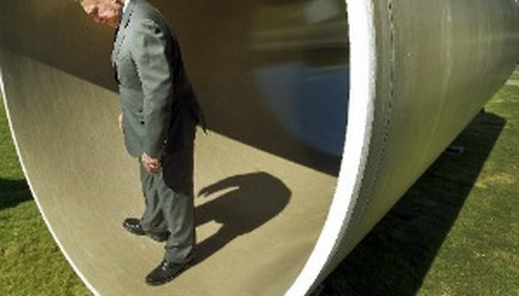 Lee Leffingwell pauses in a wastewater pipe, October 2012 (Austin American-Statesman, Ralph Barrera).