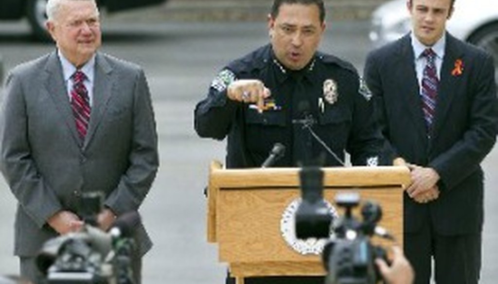 Austin Mayor Lee Leffingwell, left, looks on March 28, 2013, as the city's police chief, Art Acevedo, and former Virginia Tech student John Woods back universal background checks for gun purchasers (Deborah Cannon, Austin American-Statesman staff).