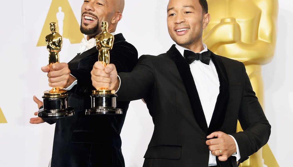Common (left) and John Legend, winners of the Best Original Song Award for 'Glory' from 'Selma,' pose in the press room during the 87th Annual Academy Awards at Loews Hollywood Hotel on Feb. 22, 2015. (Getty)