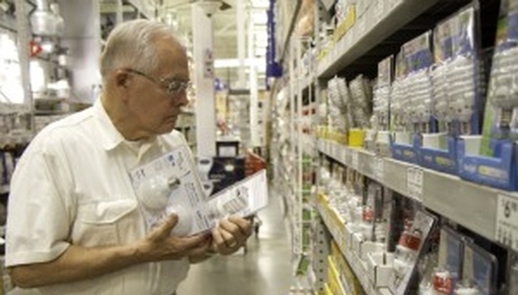 Richard Anderson browses the light bulb selection at a Lowe's in Greenville, S.C.