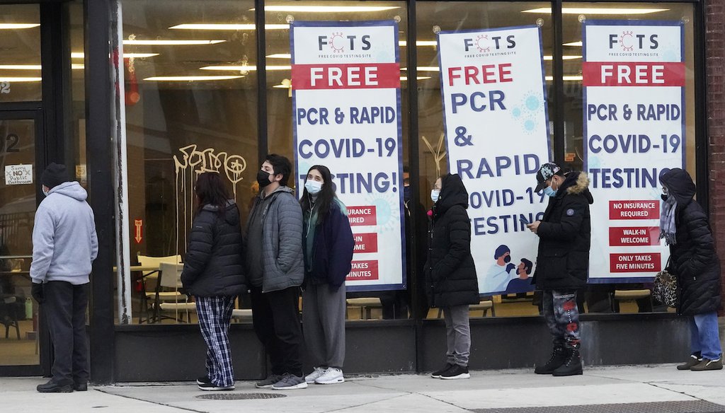 People line up to take a COVID-19 test at a free PCR and rapid testing site in Chicago on Dec. 30, 2021. (AP)