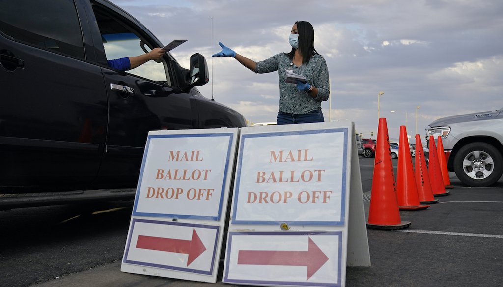In this Nov. 2, 2020, file photo, a county worker collects mail-in ballots in a drive-thru mail-in ballot drop off area at the Clark County Election Department in Las Vegas. (AP)