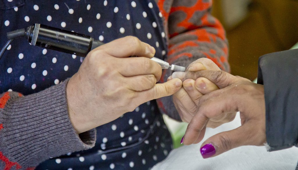 A manicurist at work in a nail salon in New York in January 2015. Cosmetology degrees are the fifth most popular program among student borrowers. (AP)