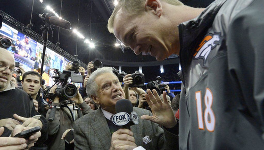 Fox Sports 1 host Regis Philbin interviews Denver Broncos quarterback Peyton Manning.
