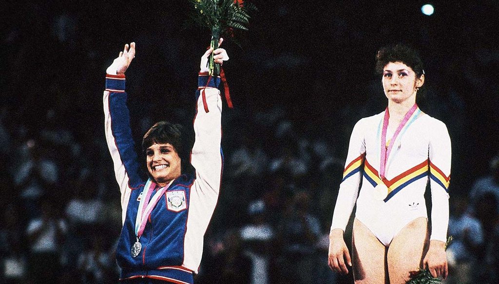 Mary Lou Retton, foreground, with her gold medal and Ecaterina Szabo with her silver medal on Aug. 5, 1984, at the 1984 Summer Olympics in Los Angeles. (AP)