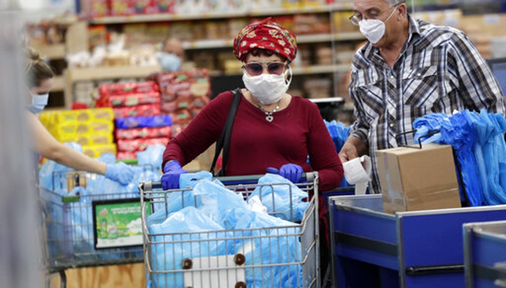 Customers wear protective masks while shopping at the Presidente Supermarket April 21, 2020, in Hialeah, Fla. (AP)