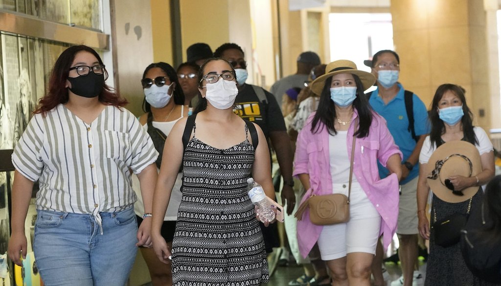 Visitors wear masks as they walk in a shopping district Thursday, July 1, 2021, in the Hollywood section of Los Angeles. (AP)
