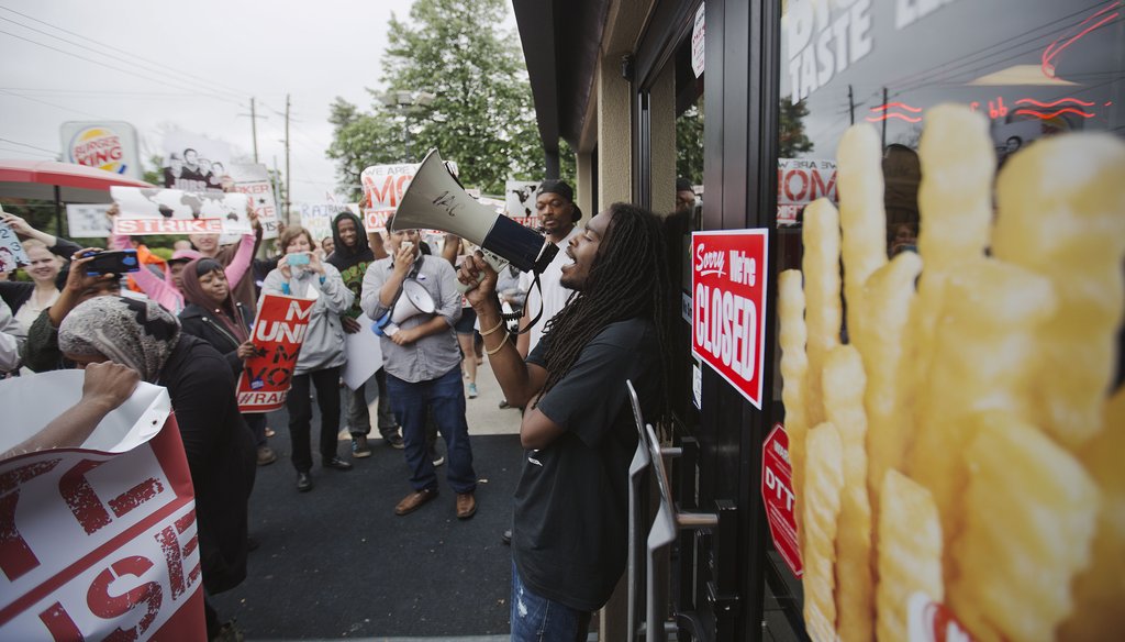 Fast food workers plan to strike again Sept. 4, 2014, over McDonald's wages. Critics point to better treatment among McDonald's workers in Denmark. (AP)