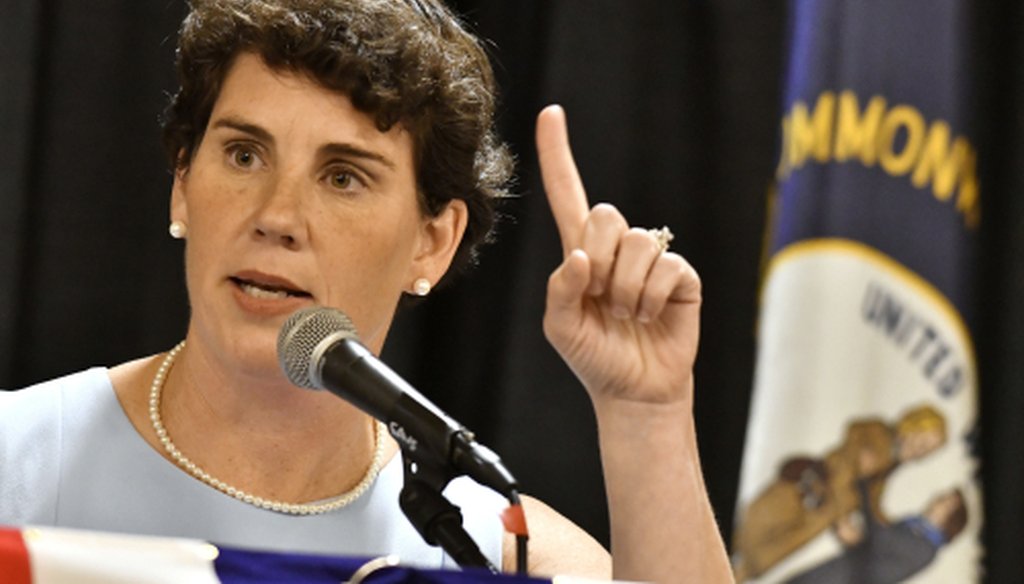 Amy McGrath, a Kentucky Democratic candidate for Congress, speaks to supporters during the 26th Annual Wendell Ford Dinner, Saturday, Aug. 18, 2018, in Louisville, Ky. (AP Photo/Timothy D. Easley)