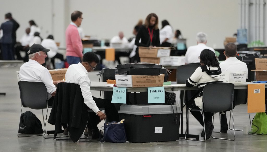 Workers tabulate absentee ballots at the Huntington Place convention center, Oct. 31, 2024, in Detroit. (AP)