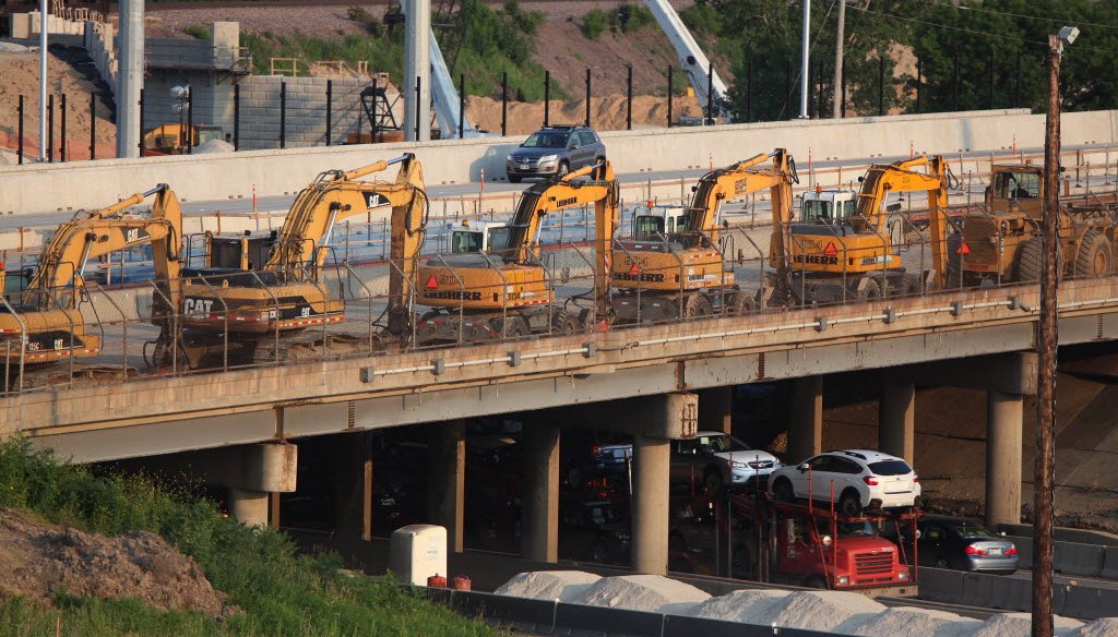 Equipment is lined on Highway 100 before the closure of I-94 at the Zoo Interchange in Milwaukee July 18, 2014. (Rick Wood / Milwaukee Journal Sentinel)