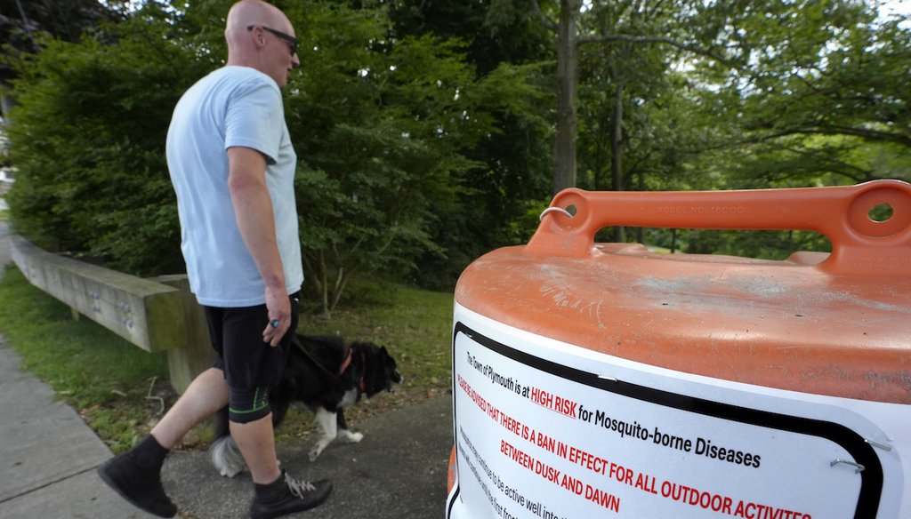 A sign in Plymouth, Mass., seen Aug. 26, 2024, advises people of a ban in effect for outdoor activity between dusk and dawn due to the risk of exposure to mosquito-borne diseases. (AP)