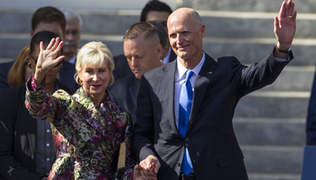 Gov. Rick Scott and First Lady Ann Scott wave to the crowd at swearing-in ceremonies in Tallahassee on Jan. 6, 2015. (AP photo)