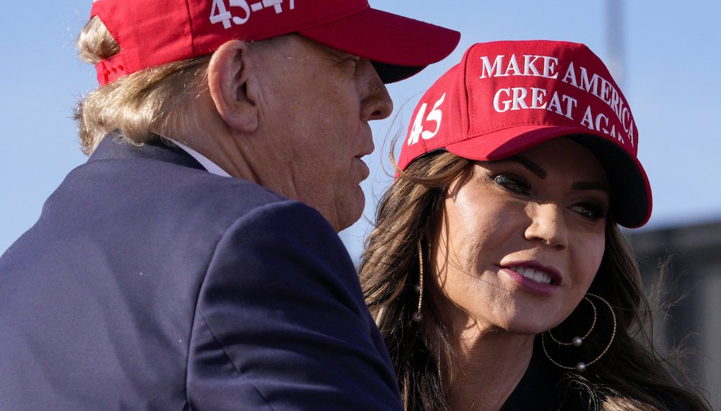 Republican presidential candidate and former President Donald Trump, left, embraces South Dakota Gov. Kristi Noem at a campaign rally March 16, 2024, in Vandalia, Ohio. (AP)