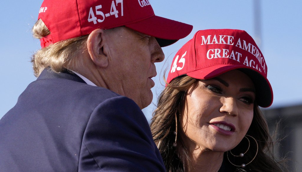 Republican presidential candidate and former President Donald Trump, left, embraces South Dakota Gov. Kristi Noem at a campaign rally March 16, 2024, in Vandalia, Ohio. (AP)