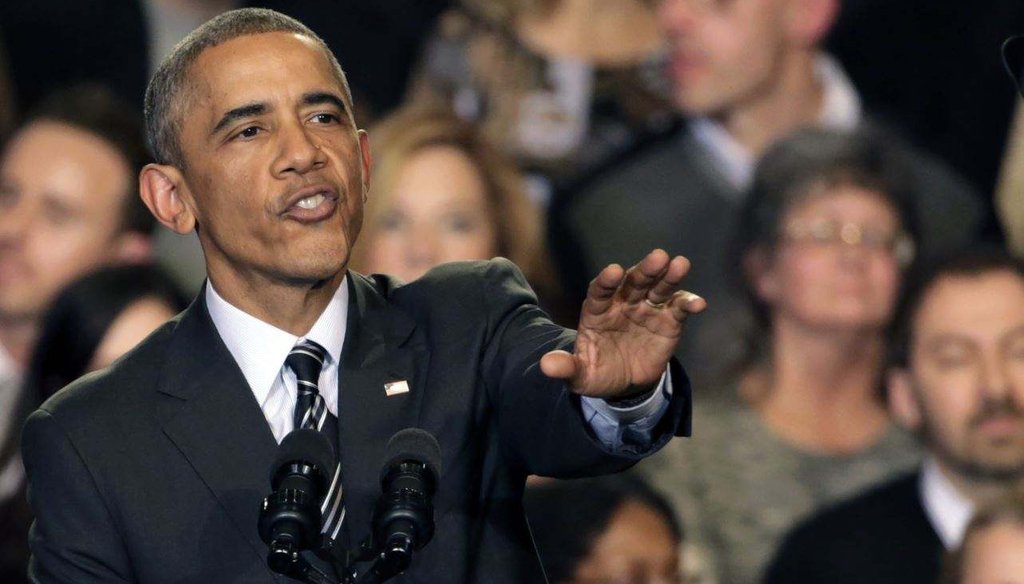 President Barack Obama tries to quiet hecklers as he addresses the crowd after meeting with community leaders about his executive action on immigration Nov. 25, 2014, in Chicago. (AP Photo/Charles Rex Arbogast)