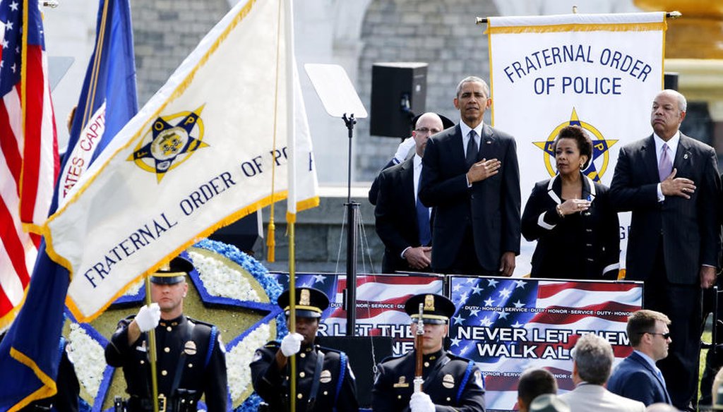 Former President Barack Obama stands for the national anthem at the National Peace Officers' Memorial Service at the U.S. Capitol in Washington May 15, 2015. (Reuters)