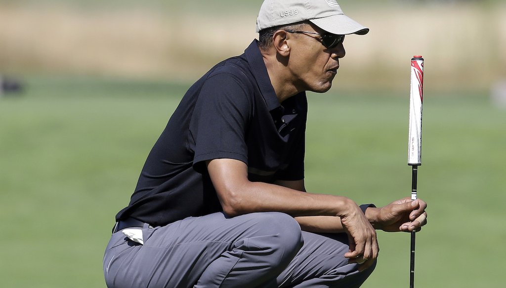Then President Barack Obama golfs Aug. 10, 2015, while wearing tape on his fingers. Some have falsely claimed that photos from July 28, 2023, of Obama golfing with taped fingers are proof his involvement in the death of his personal chef. (AP)