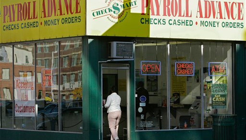 This Nov. 6, 2008 file photo shows a customer entering a Payroll Advance location in Cincinnati, Ohio. (AP)