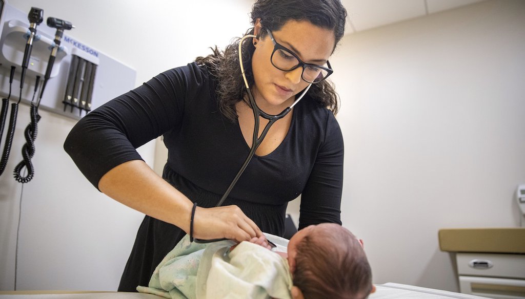 A pediatrician examines a newborn baby at her practice in Chicago,  Aug. 13, 2019. (AP)