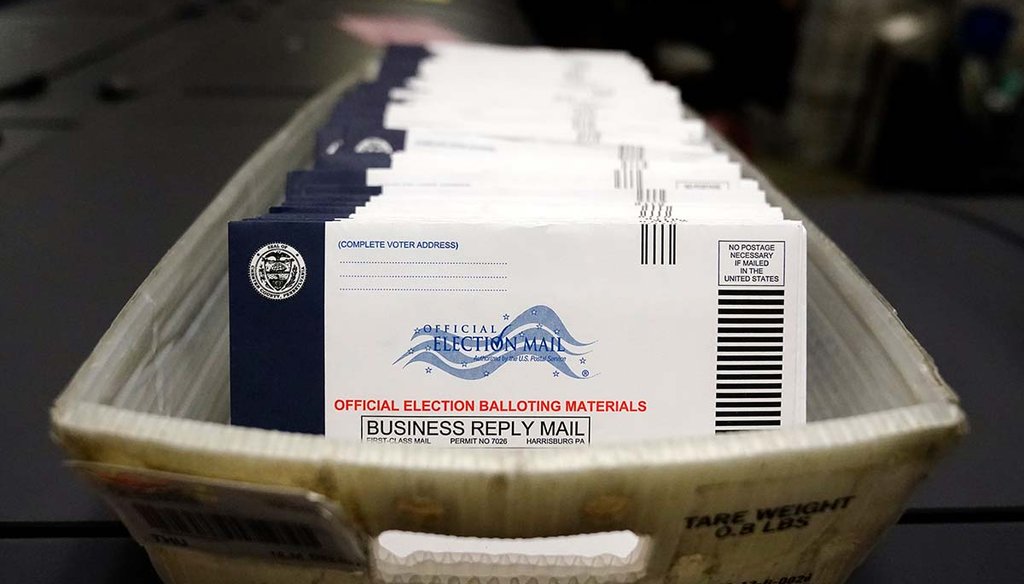 Mail-in ballots for the U.S. 2020 general election sit in a bin before being sorted at the Chester County Voter Services office, in West Chester, Pa. (AP)