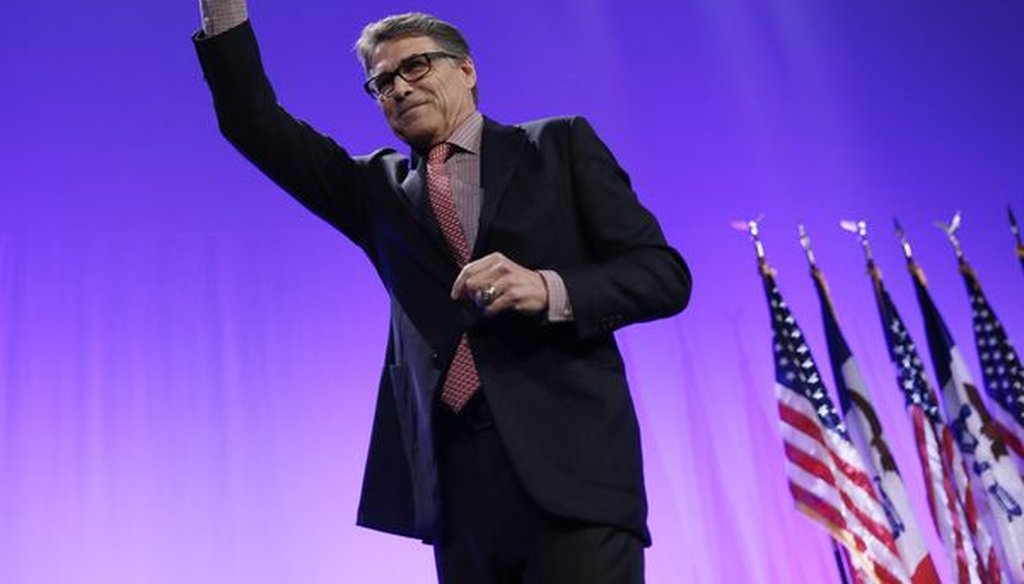 Former Texas Gov. Rick Perry waves after speaking to an Iowa crowd in May 2015 (Associated Press photo).