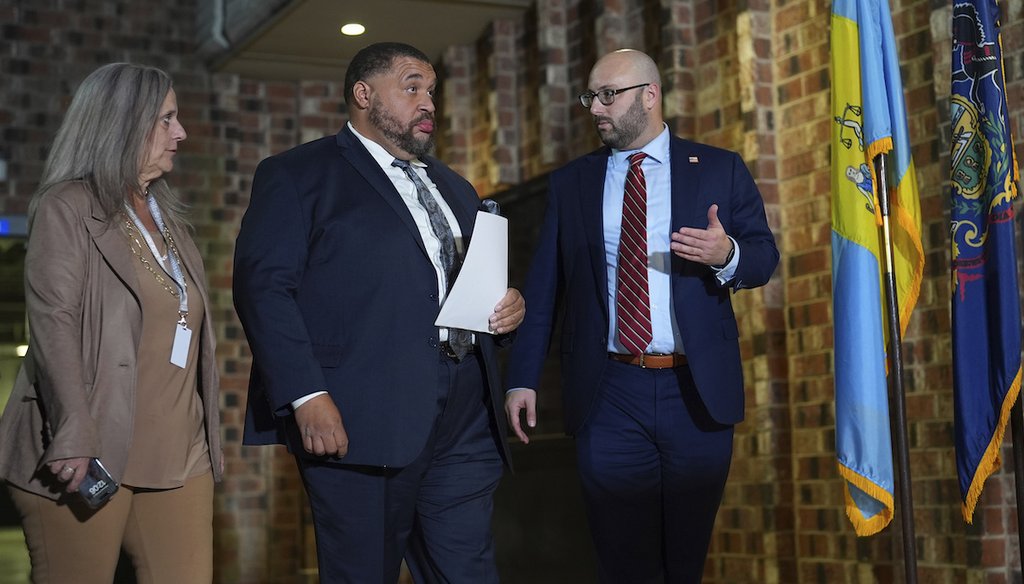 Philadelphia City Commissioners Omar Sabir, center, Lisa Deeley, left, and Seth Bluestein walk to a news conference outside the Philadelphia Election Warehouse, Nov. 6, 2024, in Philadelphia. (AP)