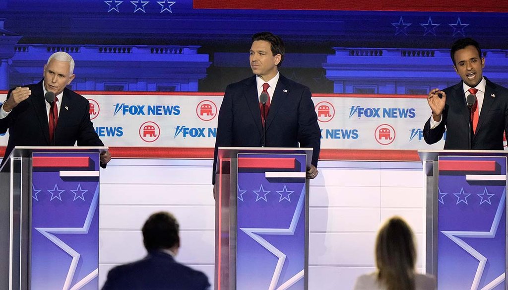 Florida Gov. Ron DeSantis listens as former Vice President Mike Pence and businessman Vivek Ramaswamy cross-talk during a Republican presidential primary debate Aug. 23, 2023, in at Fiserv Forum in Milwaukee. (AP)