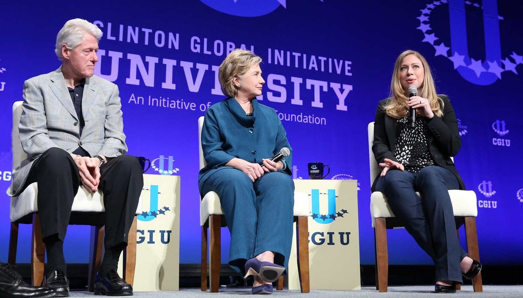 The Clinton family wraps up a Clinton Foundation event in 2014.  The foundation's donor list has drawn scrutiny on the campaign trail. (Barbara Kinney / Clinton Global Initiative)