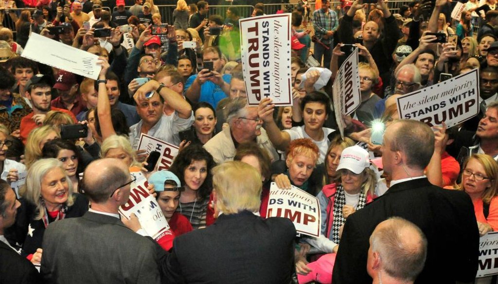 The crowd surges to greet Republican presidential candidate Donald Trump after he speaks Saturday, Nov. 21, 2015 in Birmingham, Ala. A black activist was roughed up after he interrupted Trump at the rally. (AP)