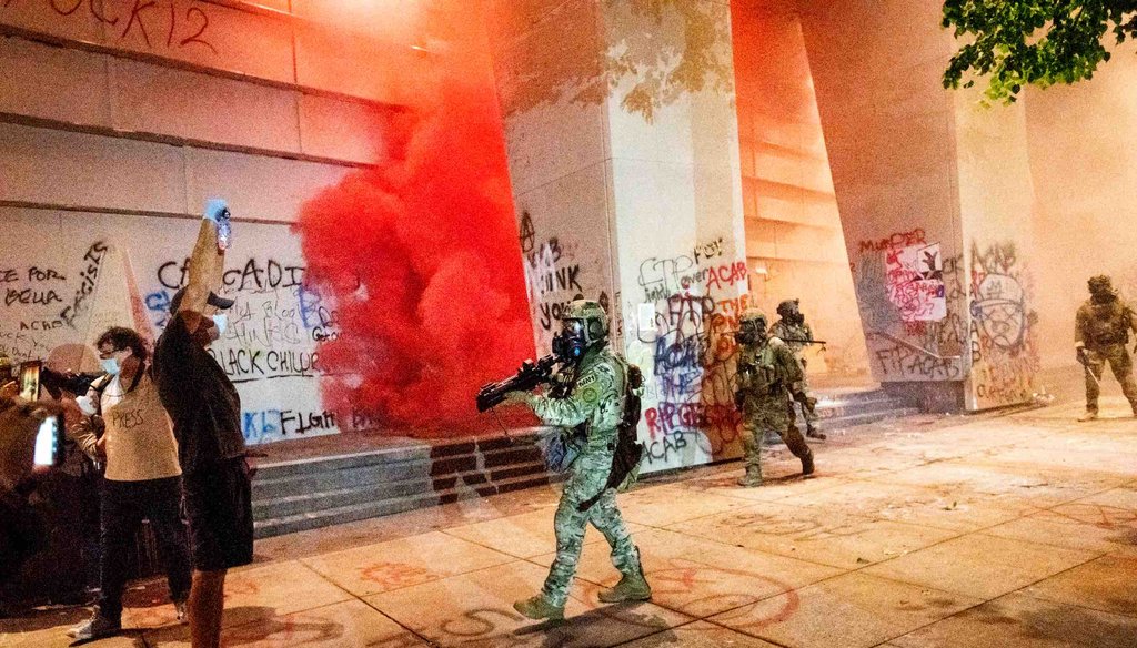 Federal officers use crowd control munitions and teargas to disperse Black Lives Matter protesters at the Mark O. Hatfield United States Courthouse on July 21, 2020, in Portland, Ore. (AP)