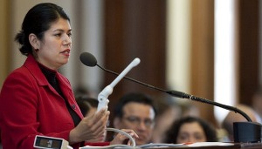 State Rep. Carol Alvarado holds a vaginal probe on the Texas House floor March 2.
