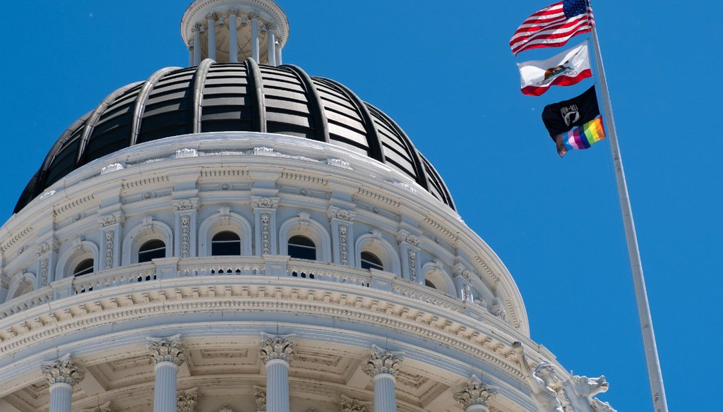 The rainbow flag, a symbol of LGBTQ pride, flies over the California state Capitol in Sacramento on June 18, 2019 / Capital Public Radio