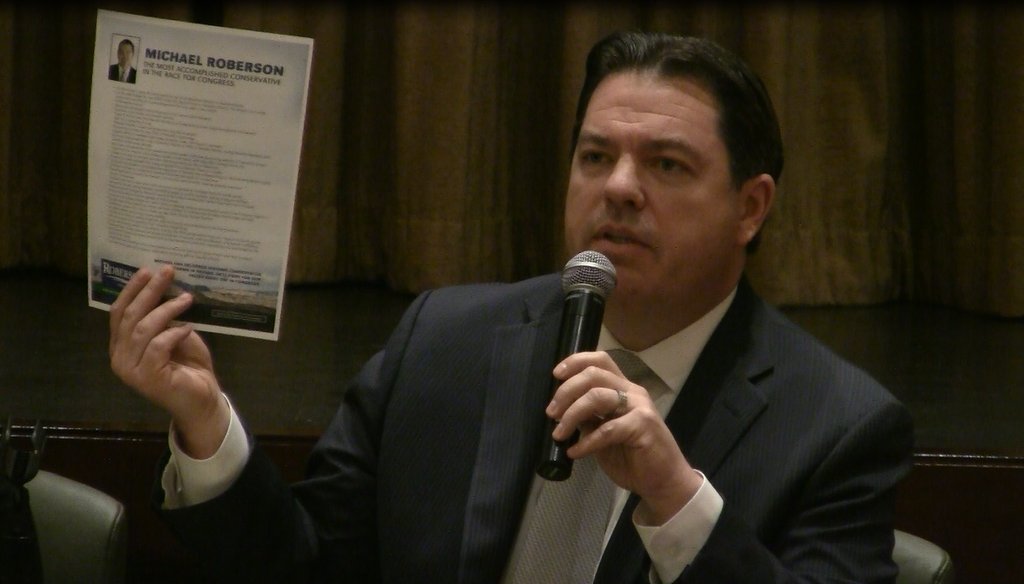 Nevada Senate Majority Leader Michael Roberson holds his campaign flyer during a congressional candidate forum on March 3, 2016.