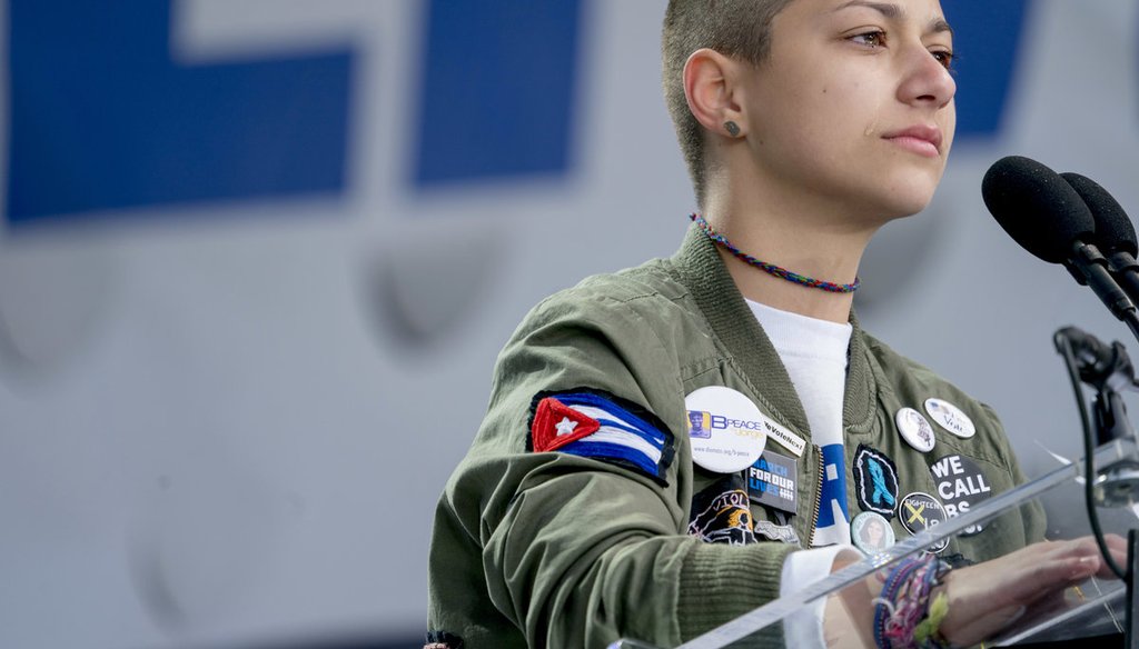 Emma Gonzalez, a survivor of the mass shooting at Marjory Stoneman Douglas High School in Parkland, Fla., stands silently at the podium during the "March for Our Lives" rally in support of gun control in Washington on March 24, 2018. (AP Photo/Andrew Harn