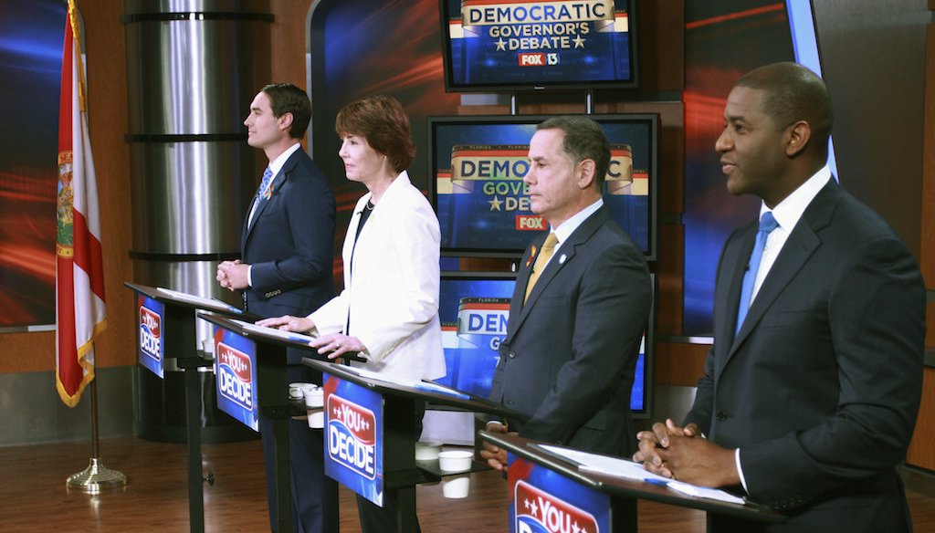 Tallahassee Mayor Andrew Gillum, Miami Beach Mayor Philip Levine, former Congresswoman Gwen Graham, and businessman Chris King listen to the moderator during the first gubernatorial debate in the Democratic primary, April 18, 2018 in Tampa. (WTVT Fox 13)