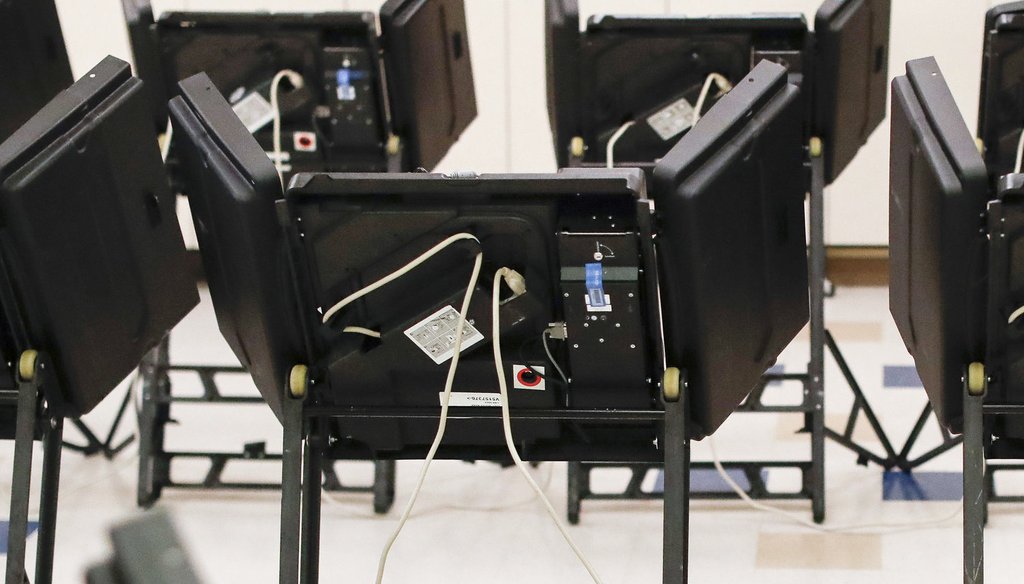 This Tuesday, Aug. 7, 2018 file photo shows electronic voting machines in a polling station in Dublin, Ohio. (AP Photo/John Minchillo)