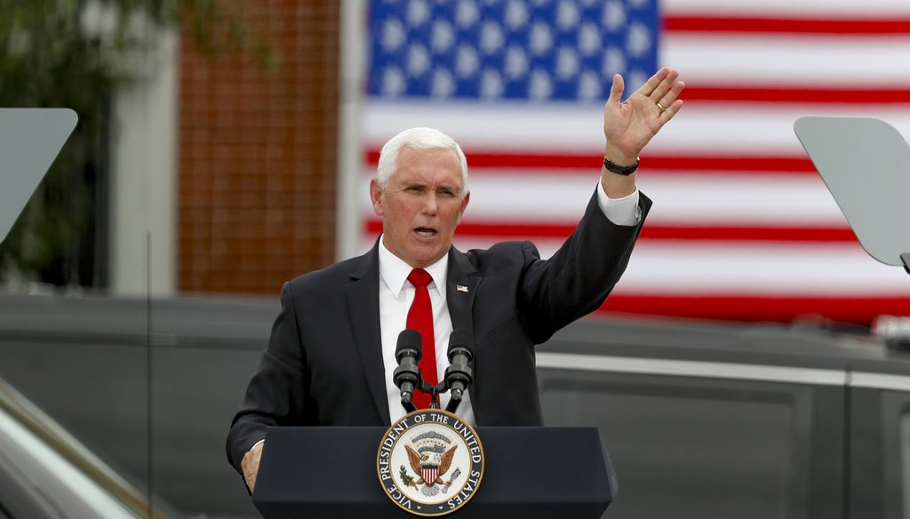 Vice President Mike Pence waves after he spoke at a "Cops for Trump" campaign event at the police station, Thursday, July 30, 2020, in Greensburg, Pa. (AP Photo/Keith Srakocic)