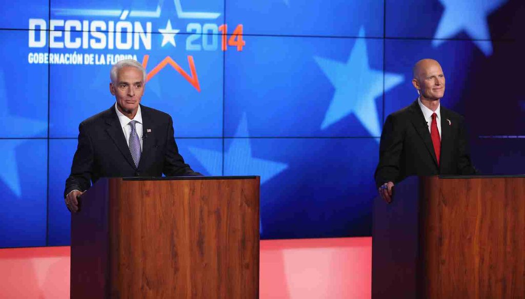Former Gov. Charlie Crist and current Gov. Rick Scott in a debate hosted by Telemundo on Oct. 10, 2014.