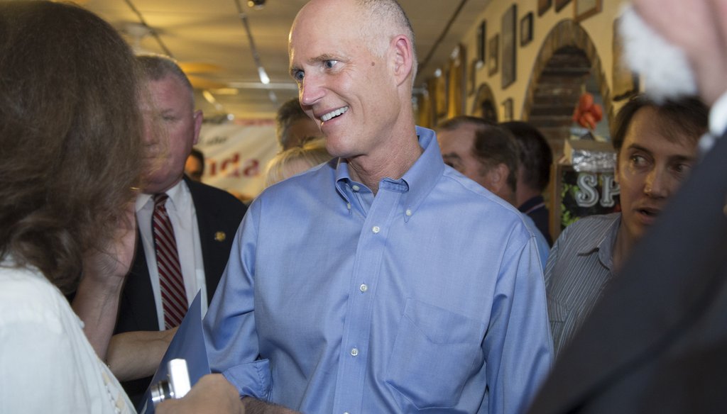Gov. Rick Scott meets with supporters in Plantation back on Oct. 26, 2014. His jobs promise remained central to his re-election efforts. (New York Times photo)