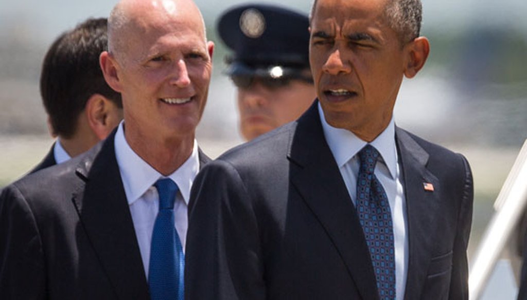 Gov. Rick Scott and President Barack Obama meet at Orlando International Airport on June 16, 2016. (Tampa Bay Times photo)