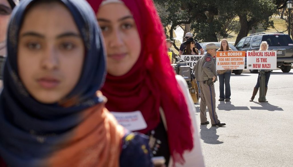 A day devoted to Muslims at the Texas Capitol drew believers and protesters Jan. 29, 2015. Our 2011 fact check failed to find Shariah law being imposed by a court in Michigan. (Photo, Jay Janner, Austin American-Statesman).