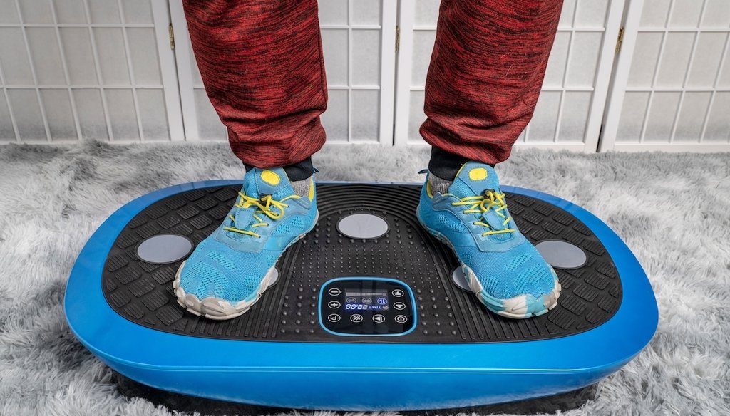 A person stands on a vibration plate. (Shutterstock)