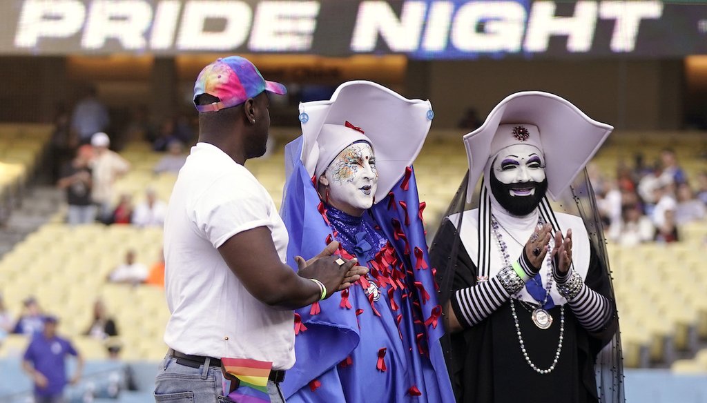 Gerald Garth, left, stands with members of the Sisters of Perpetual Indulgence, Sister Unity, center, and Sister Dominia as they were honored during LGBTQ+ Pride Night prior to the Dodgers game, June 16, 2023, in Los Angeles. (AP)