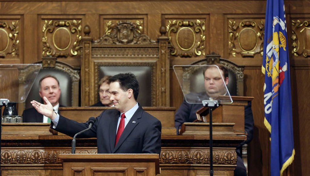 Wisconsin Gov. Scott Walker acknowledges guests during his State of the State address on Jan. 22, 2014 