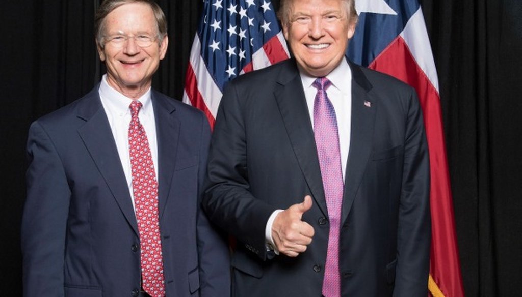 U.S. Rep. Lamar Smith, R-San Antonio, pauses with Donald Trump. We found accurate Smith's claim he was the first member of Congress to donate to Trump's campaign (photo received by email from Jordan Berry, consultant to Smith's campaign, Nov. 11, 2016).