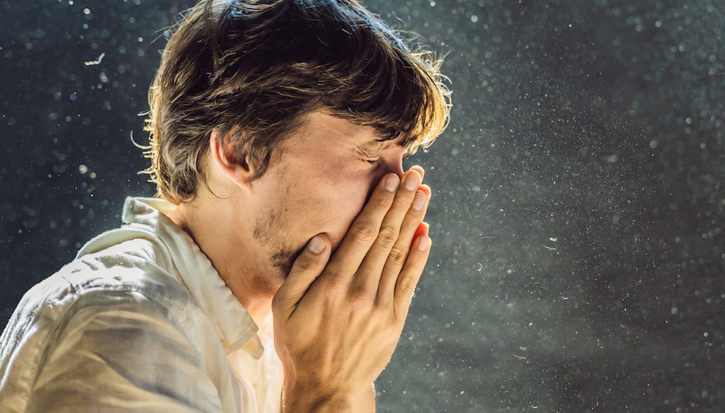 A sneeze or cough sends thousands of viral particles into the air. The question is, how far do they travel? (Shutterstock)