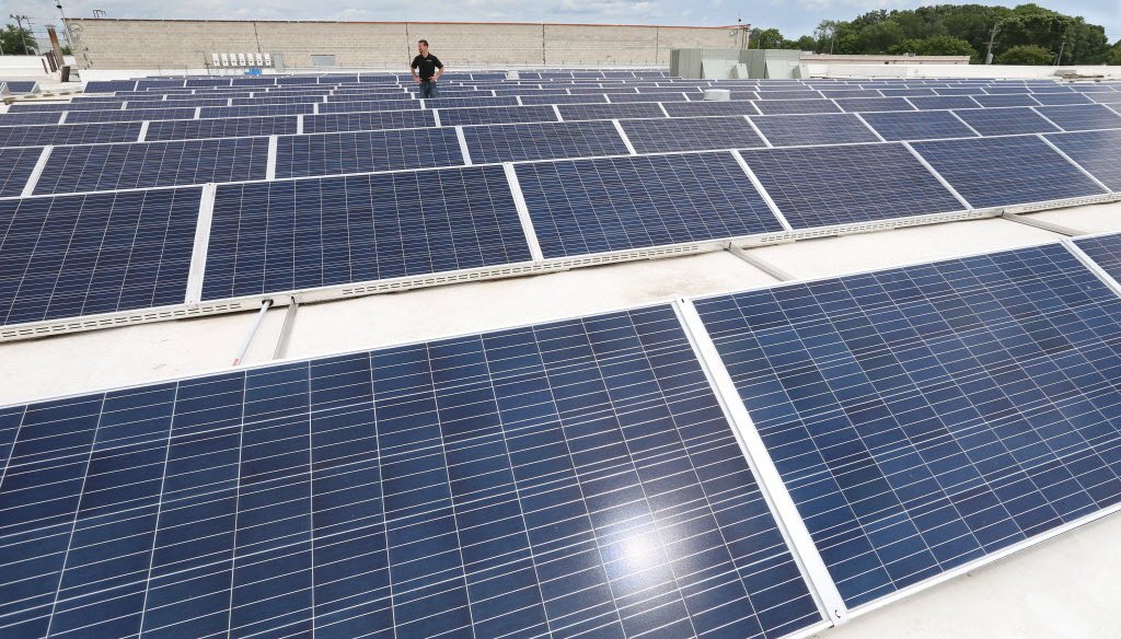 Solar panels dot the rooftops of homes in Groveland, Fla. (AP photo)